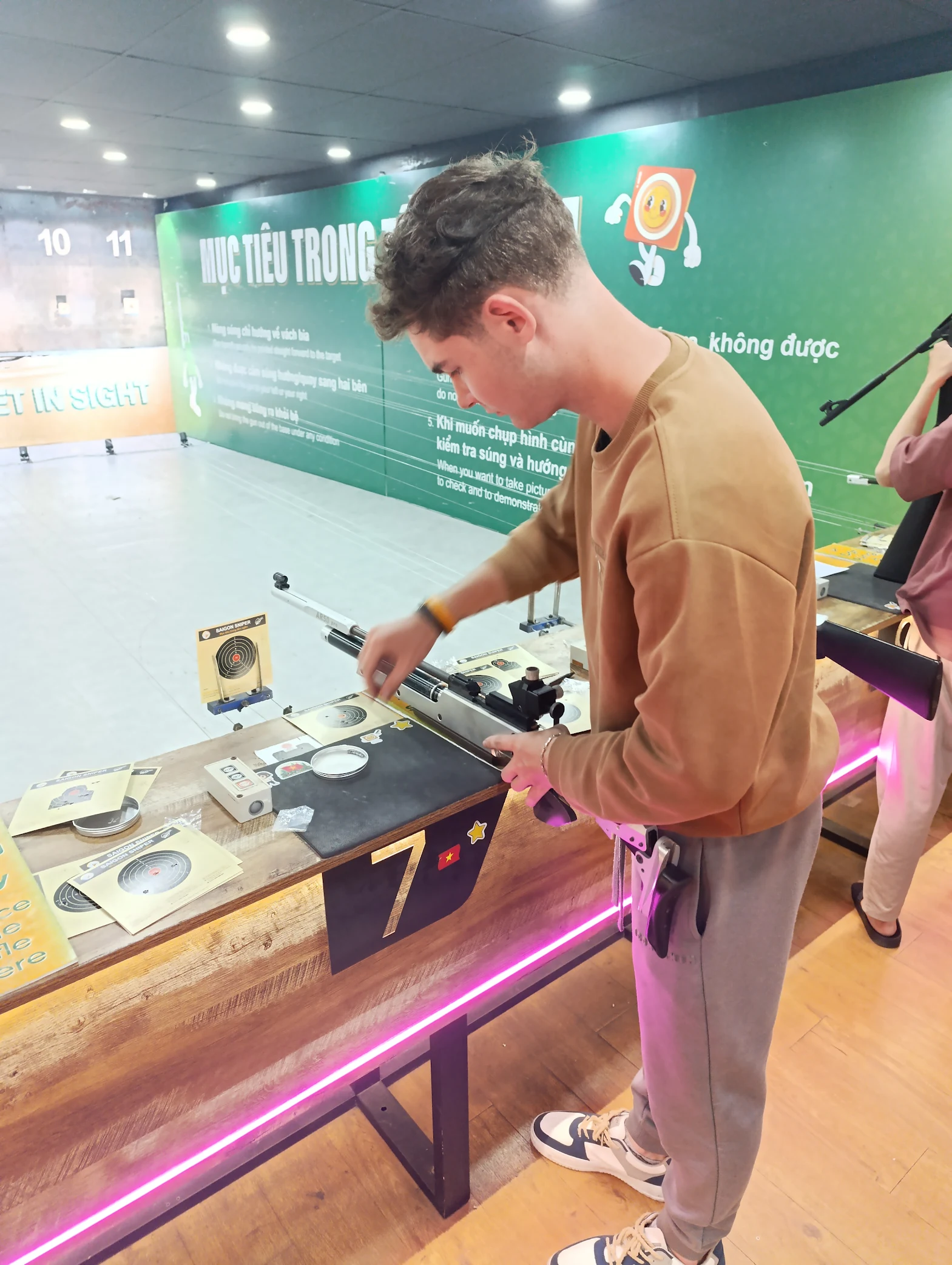 Indoor 10m air rifle lanes and equipment at Saigon Sniper in District 1, Ho Chi Minh City